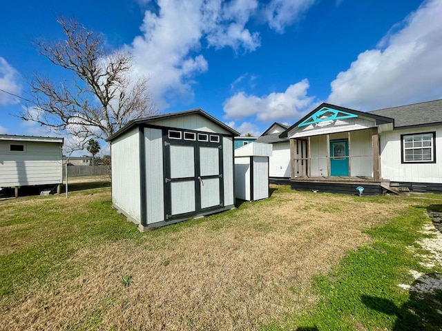 view of outbuilding featuring a yard