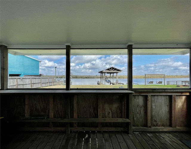 wooden deck featuring a water view