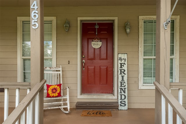 doorway to property featuring a porch