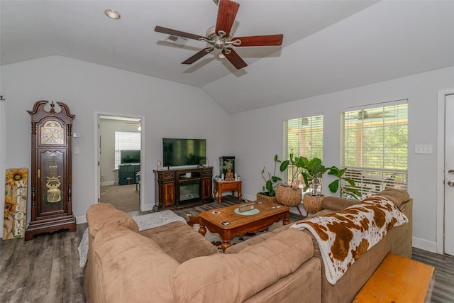 living room with dark wood-type flooring, ceiling fan, and vaulted ceiling