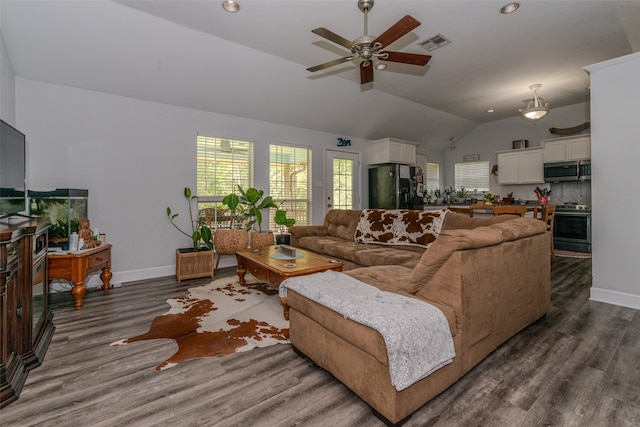 living room with lofted ceiling, ceiling fan, and dark hardwood / wood-style flooring