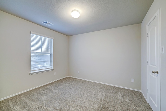 14242 W Pine Heart Dr, Conroe, TX 77302 - carpeted spare room featuring baseboards and a textured ceiling