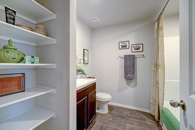 14242 W Pine Heart Dr, Conroe, TX 77302 - bathroom with vanity, wood finished floors, and a shower with shower curtain
