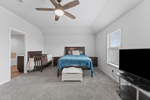 bedroom with lofted ceiling, ceiling fan, and carpet floors