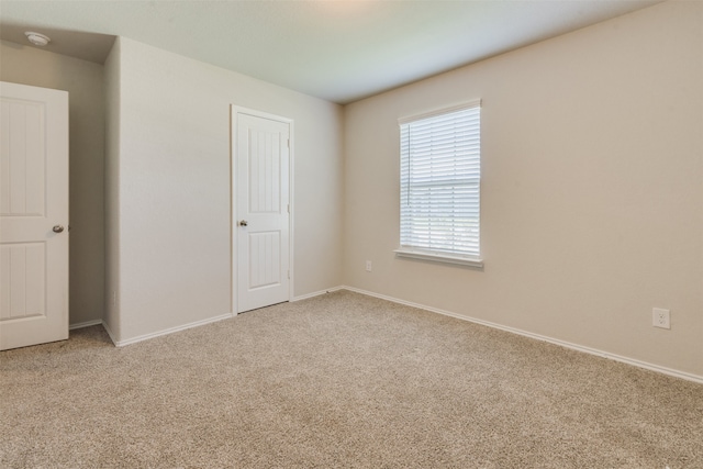 unfurnished bedroom with light carpet