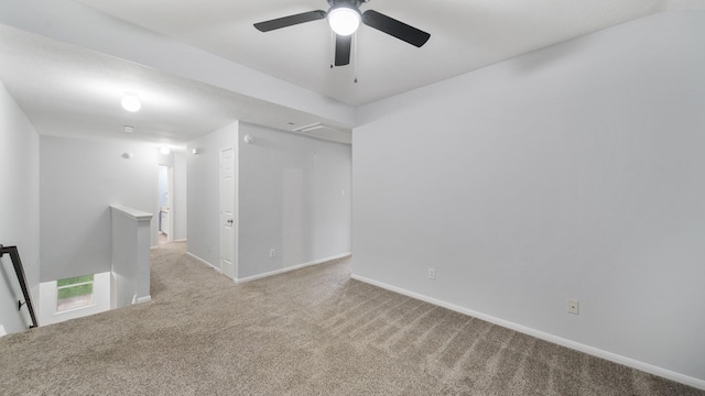 unfurnished room with light carpet and ceiling fan