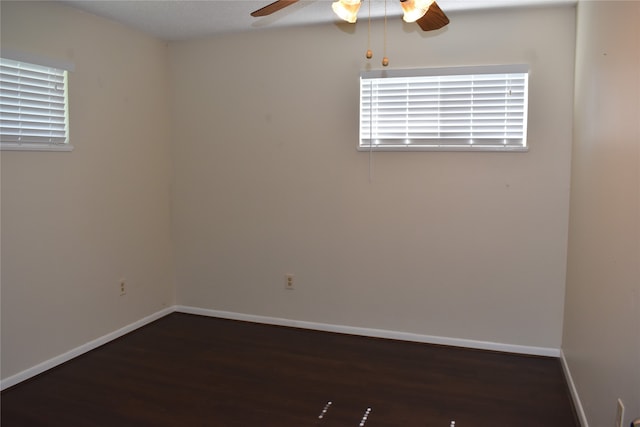 empty room with ceiling fan and hardwood / wood-style flooring