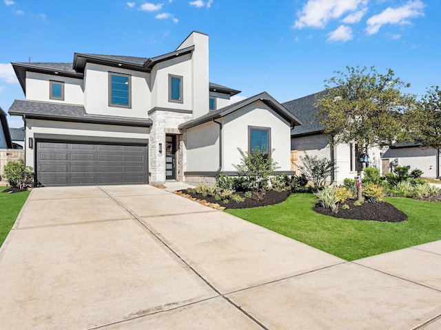 view of front of home with stone siding, stucco siding, an attached garage, and a front lawn