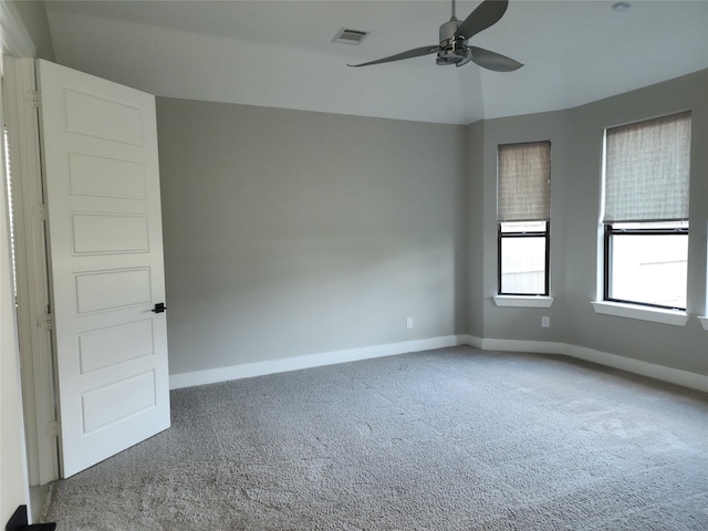 spare room with carpet, ceiling fan, and lofted ceiling