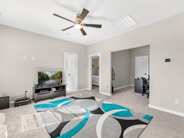 carpeted living room featuring ceiling fan