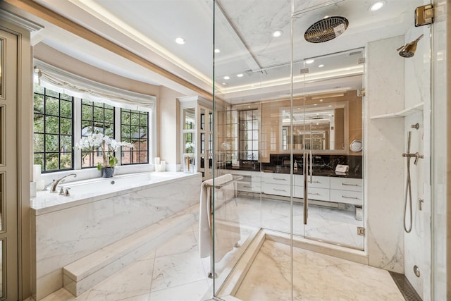 bathroom featuring vanity and separate shower and tub