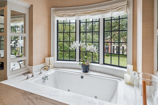 bathroom with tiled bath