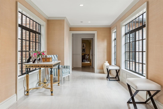 hall featuring ornamental molding