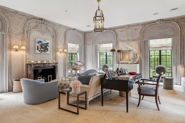 living area featuring light carpet and plenty of natural light