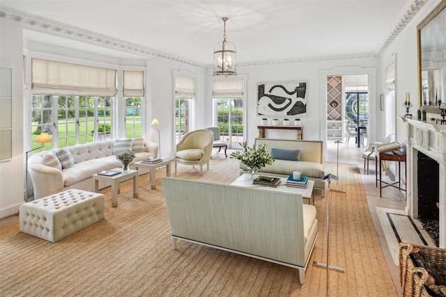 living room featuring crown molding and a notable chandelier