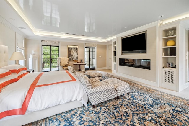 bedroom featuring crown molding and a tray ceiling