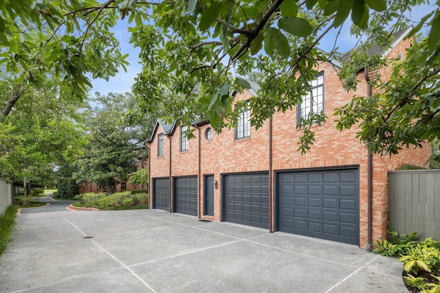 view of side of home with a garage