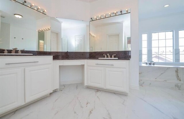 bathroom featuring crown molding, vanity, and a bath