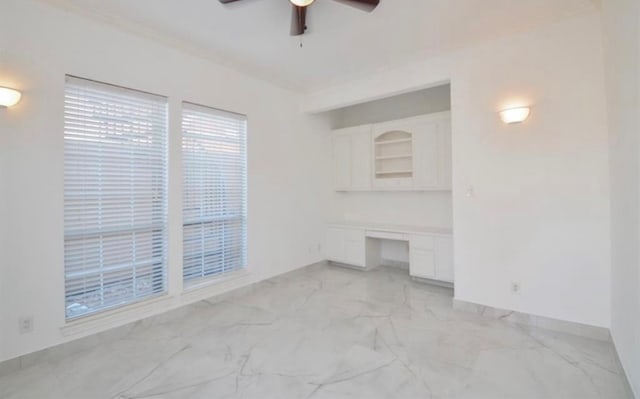 unfurnished living room with ceiling fan