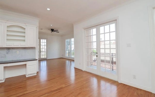 unfurnished living room with ornamental molding, french doors, light hardwood / wood-style flooring, and ceiling fan