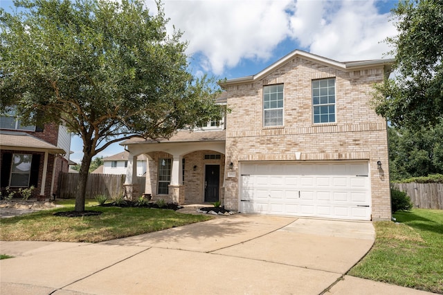 view of front facade featuring a garage and a front yard