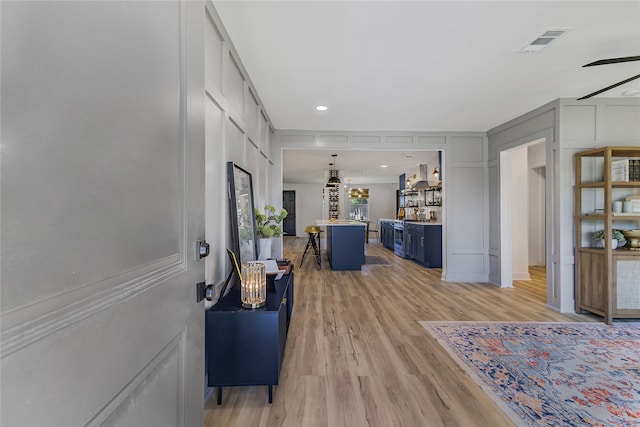 office area featuring ceiling fan and light hardwood / wood-style flooring