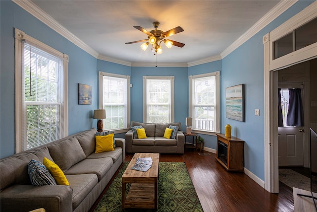 living room featuring ceiling fan, plenty of natural light, dark hardwood / wood-style flooring, and crown molding