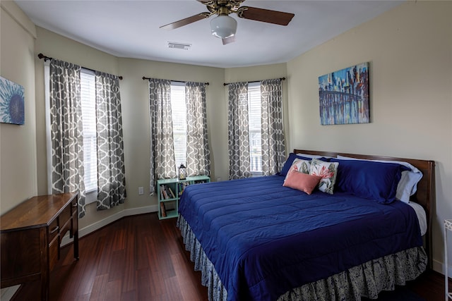 bedroom featuring ceiling fan and dark hardwood / wood-style floors