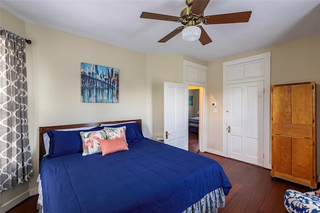 bedroom featuring dark wood-type flooring and ceiling fan