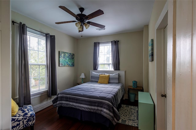 bedroom featuring dark wood-type flooring and ceiling fan