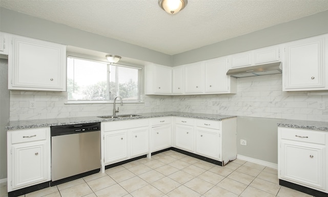 kitchen featuring backsplash, light tile patterned floors, dishwasher, white cabinetry, and sink