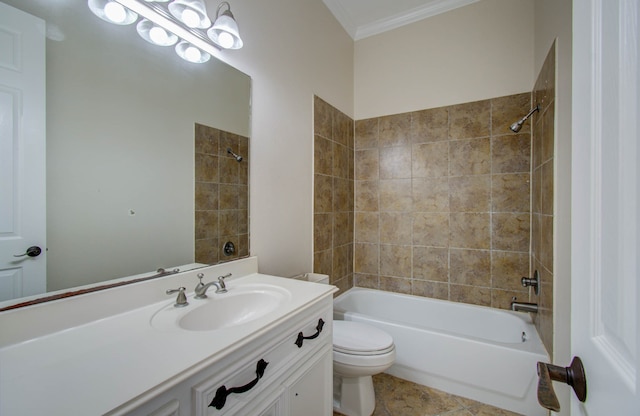 full bathroom featuring tiled shower / bath, toilet, ornamental molding, vanity, and tile patterned flooring