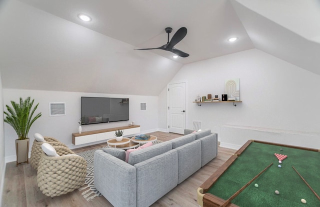 living room featuring wood-type flooring, vaulted ceiling, and ceiling fan