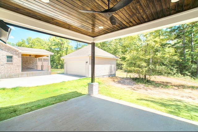 view of patio featuring an outdoor structure and a garage