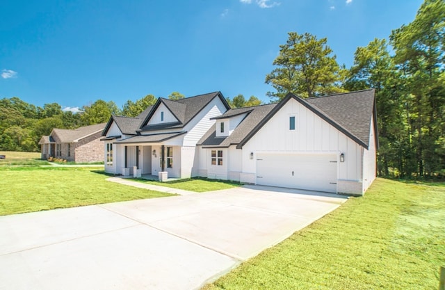 modern inspired farmhouse featuring a garage and a front lawn