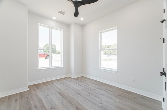 spare room with ceiling fan, light hardwood / wood-style flooring, and plenty of natural light