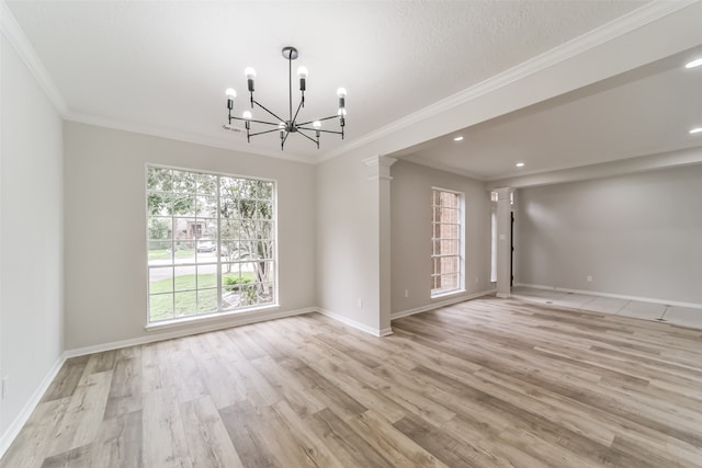 unfurnished room featuring crown molding, a notable chandelier, and light hardwood / wood-style floors