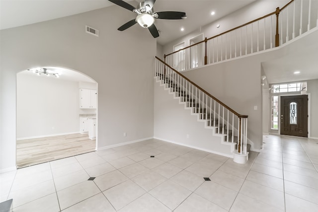 interior space featuring high vaulted ceiling and ceiling fan