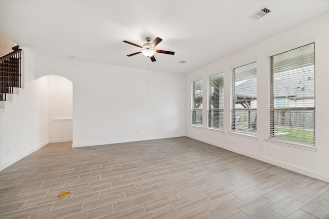 unfurnished room featuring ceiling fan and light wood-type flooring