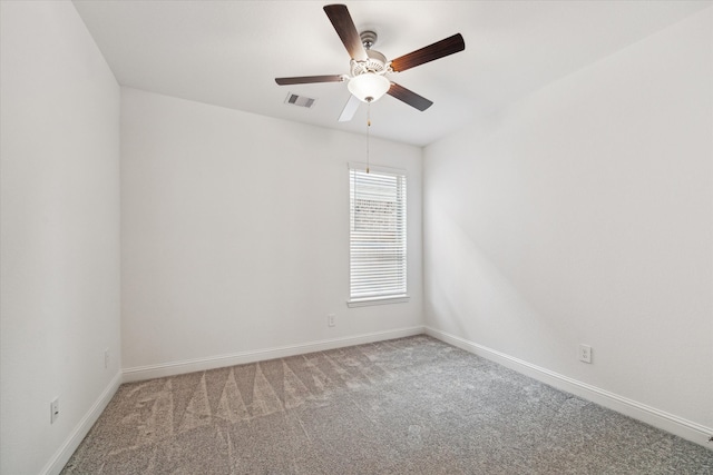 unfurnished room featuring light colored carpet and ceiling fan