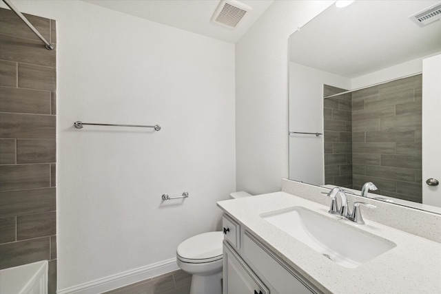 full bathroom featuring vanity, toilet, and tiled shower / bath