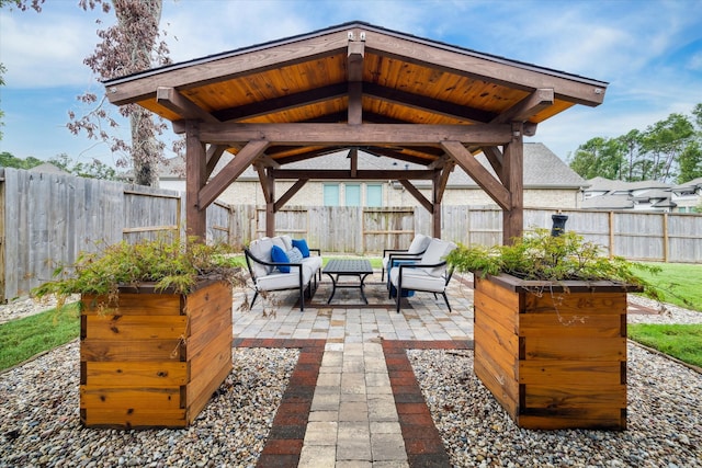 view of patio with an outdoor fire pit and a gazebo