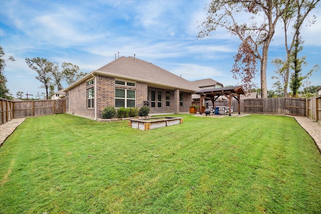 back of house featuring a yard and a patio