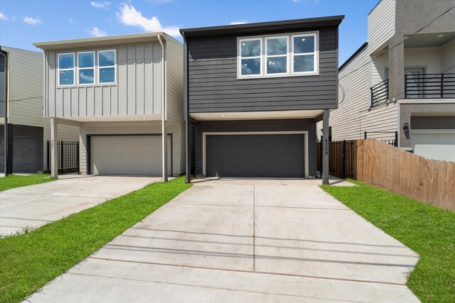 view of front of home featuring a garage and a balcony