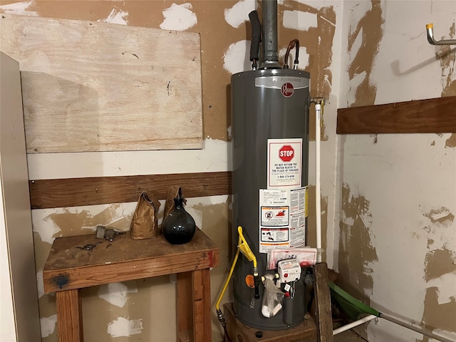 utility room featuring water heater