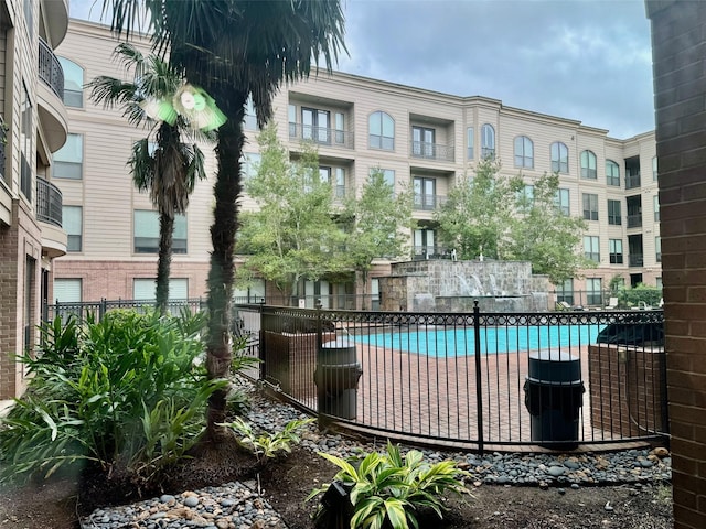 2299 Lone Star Dr Unit 145, Sugar Land, TX 77479 - view of swimming pool with fence