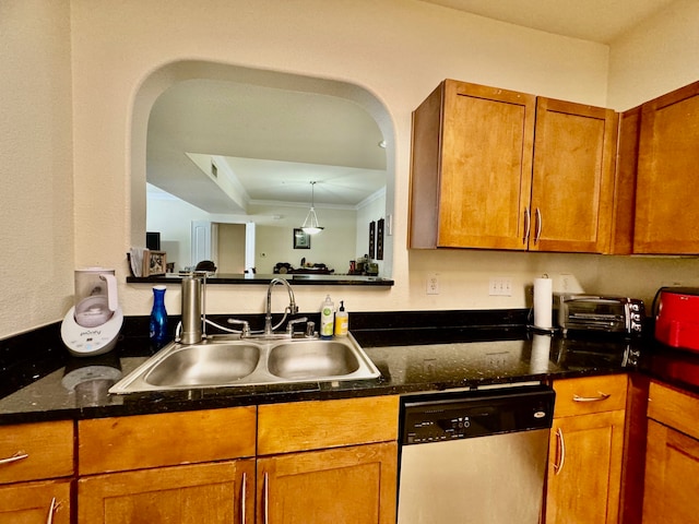 kitchen featuring sink, crown molding, a tray ceiling, and dishwasher