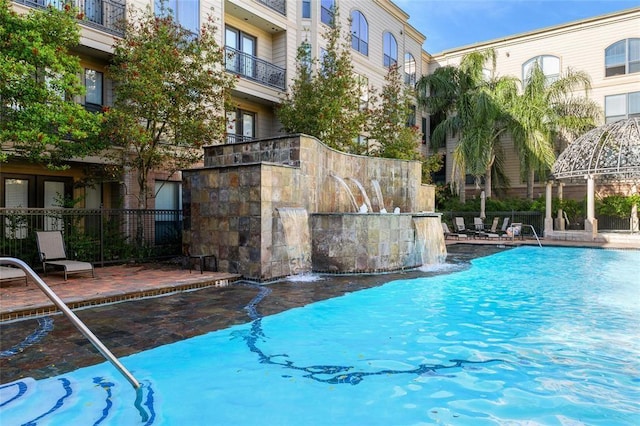 2299 Lone Star Dr Unit 145, Sugar Land, TX 77479 - view of swimming pool featuring a patio