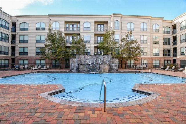 view of pool featuring a patio and pool water feature