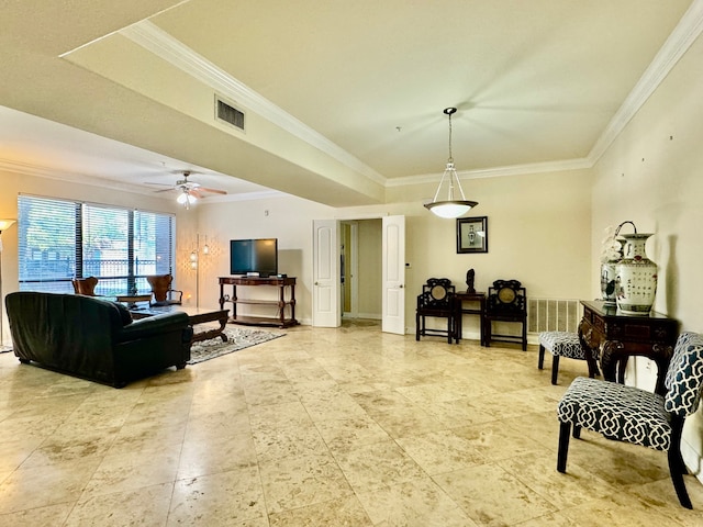 living room featuring crown molding, a raised ceiling, and ceiling fan